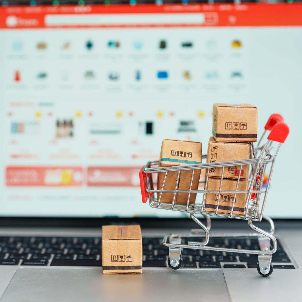 boxes with shopping cart on a laptop computer. online shopping,