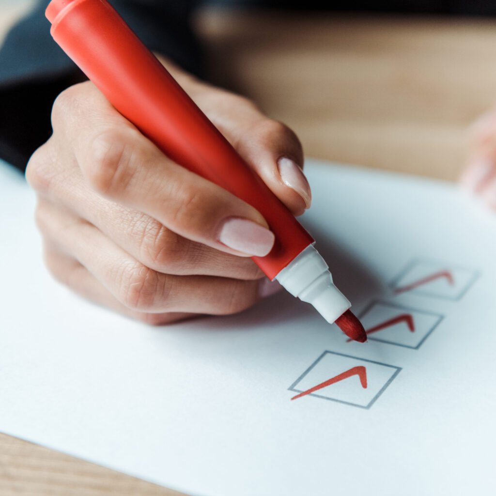 close up of woman putting check park in check list