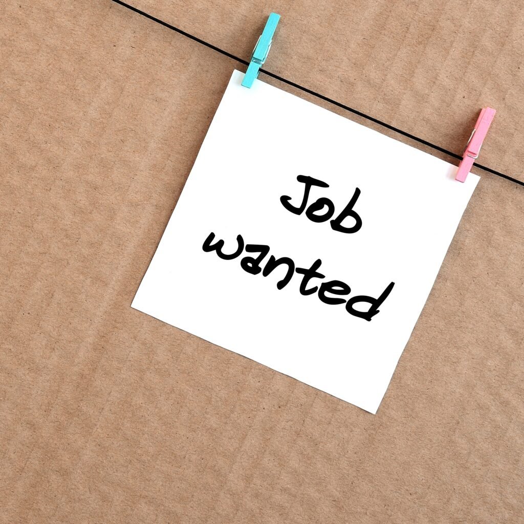 job wanted. note is written on a white sticker that hangs with a